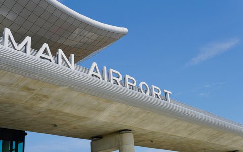 Curved terminal canopy with large Airport lettering at Zagreb Franjo Tudman Airport