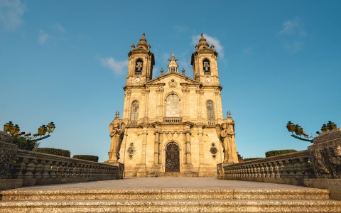 The twin-towered church of Bom Jesus do Monte at the top of its stairway, under a clear blue sky