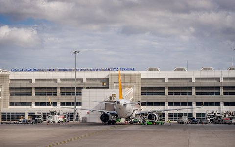 Airliner parked in front of the domestic terminal at Antalya Airport