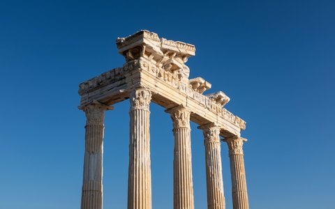 The standing marble columns of the Temple of Apollo at Side against a vivid blue sky